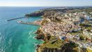 Add traveling to Albufeira, a coastal city in the southern region of Portugal during your 10 days trip to Portugal.