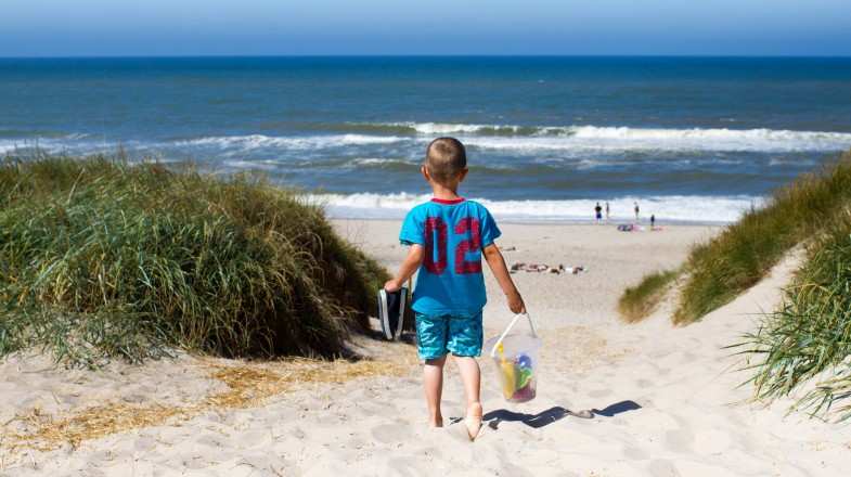 A boy headed to the beach on his trip to Denmark in August.