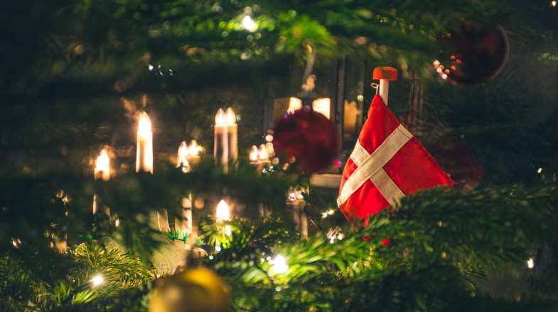 A closeup shot of Christmas tree with a Danish flag ornament taken in Denmark in December.