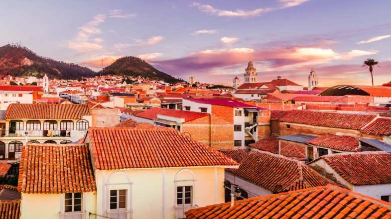 A warm sunset view over the cityscape of Sucre in Bolivia in December.