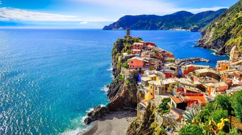 Scenic view of colorful village Vernessa and ocean coast in Cinque Terre of Italy in June.