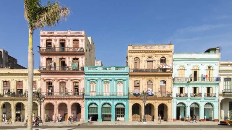A view of a street with colorful houses at Old Havana in Cuba in May.