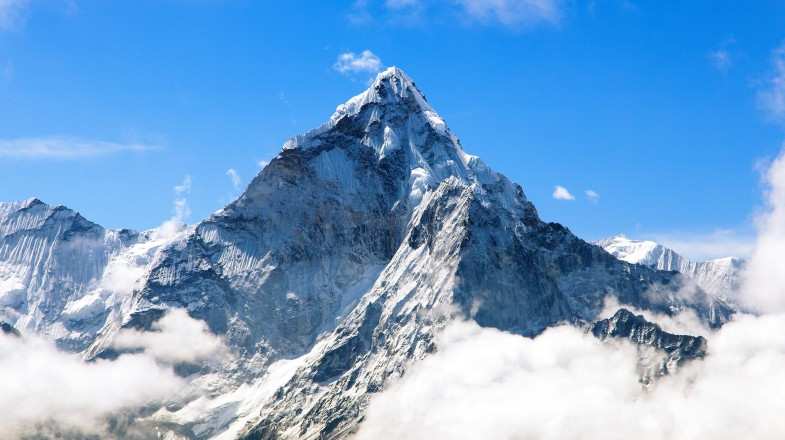 See mountains rise above clouds during Everest Base Camp trek in November.