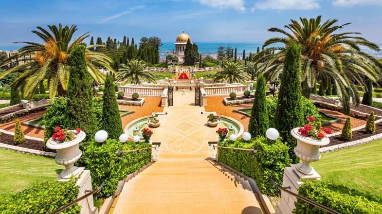 Magnificent colonnade with a gilded dome on Mount Carmel in Israel in May.