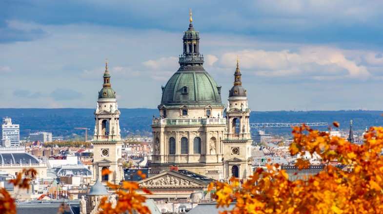 Fall leaves frame St. Stephen's Basilica in Hungary in September.