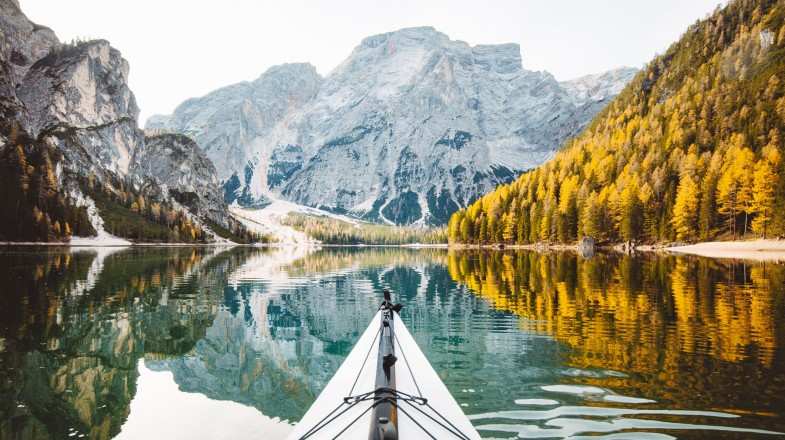 The view of Lago di Braies in the autumn foliage in Italy in November.