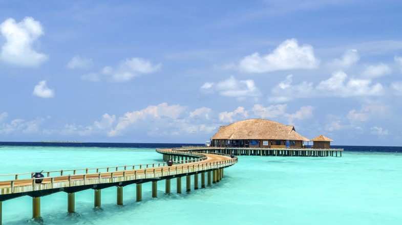 Water villas in a hotel resort in the Maldives in July