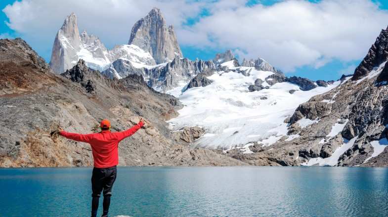 A young man enjoying the view of Mt. Fitz in Patagonia in August.