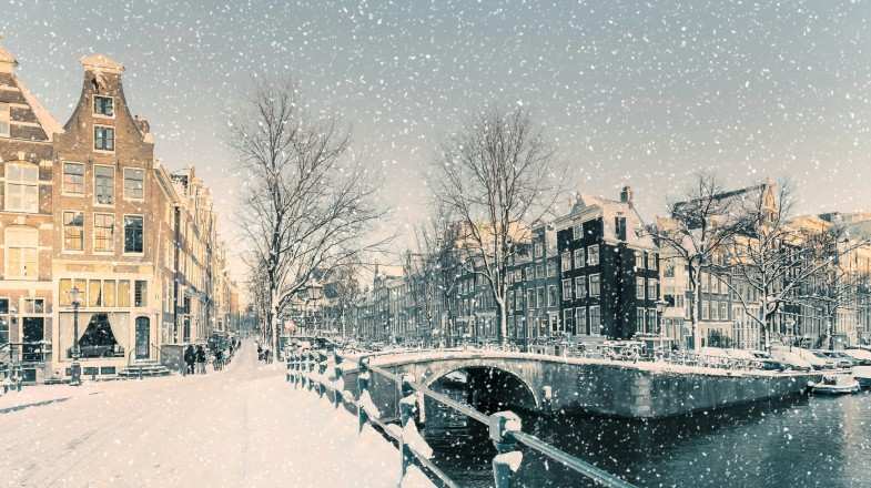 Snowfall in Amsterdam at a canal in the Netherlands in February.