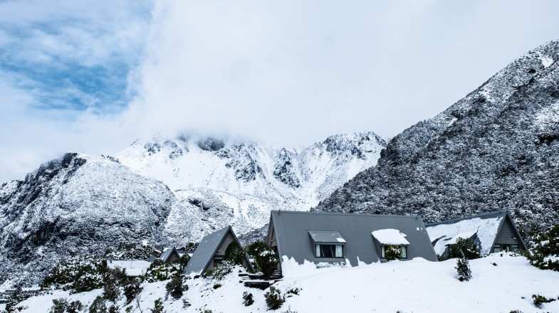 Stay at a ski resort in New Zealand in July.