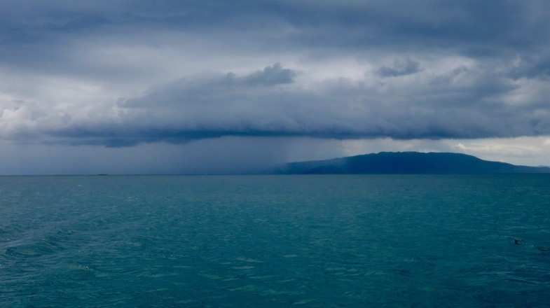 Rain cloud above the ocean in the Philippines in September.