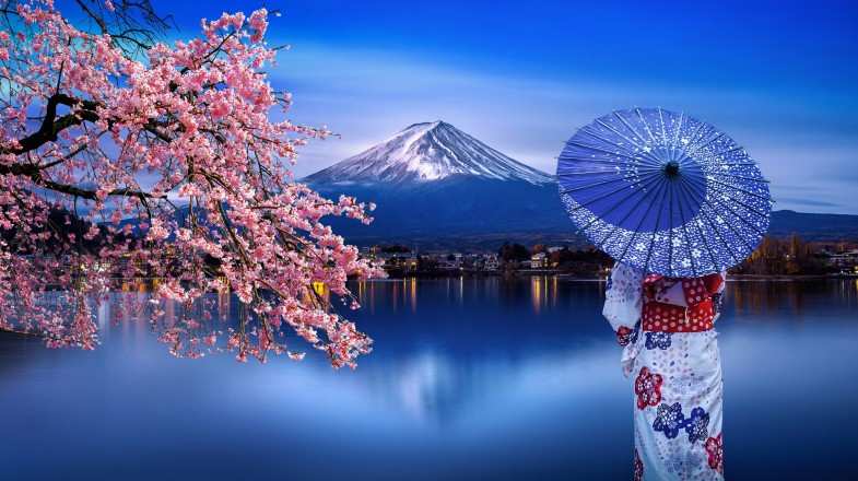 Woman wearing a kimono looking at Mt. Fuji