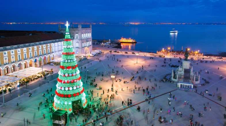 Christmas tree on Commerce square at twilight in Lisbon in Portugal in December.