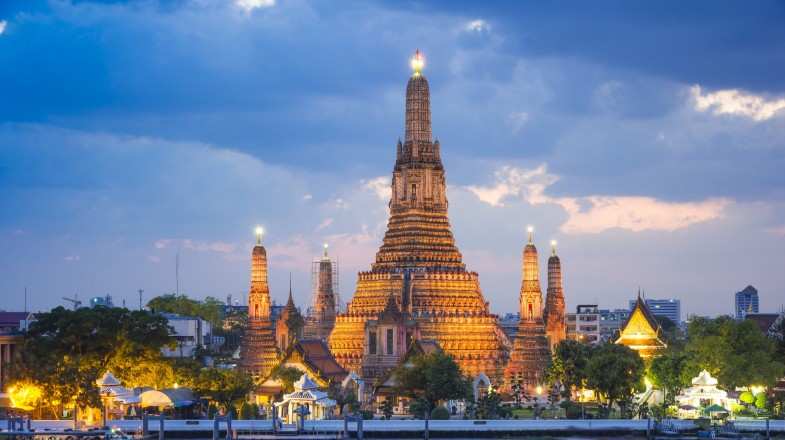 Wat Arun temple in the cloudy weather in Thailand in August.