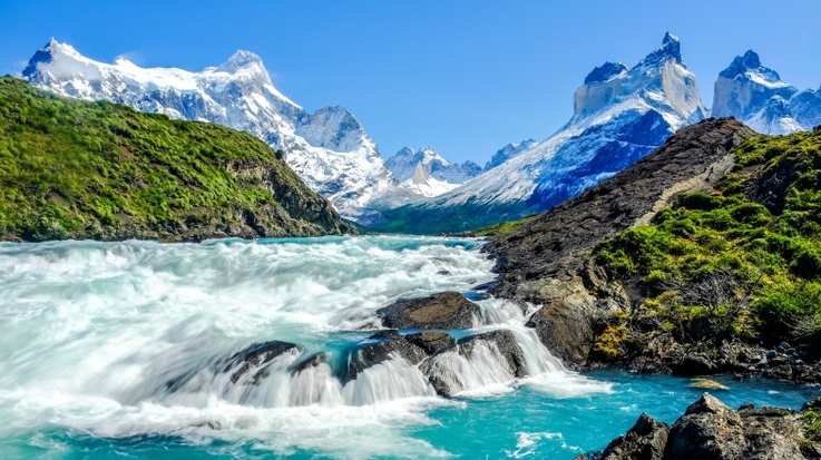 Beautiful landscape photo and waterfall with Andes Mountain in Patagonia in December.