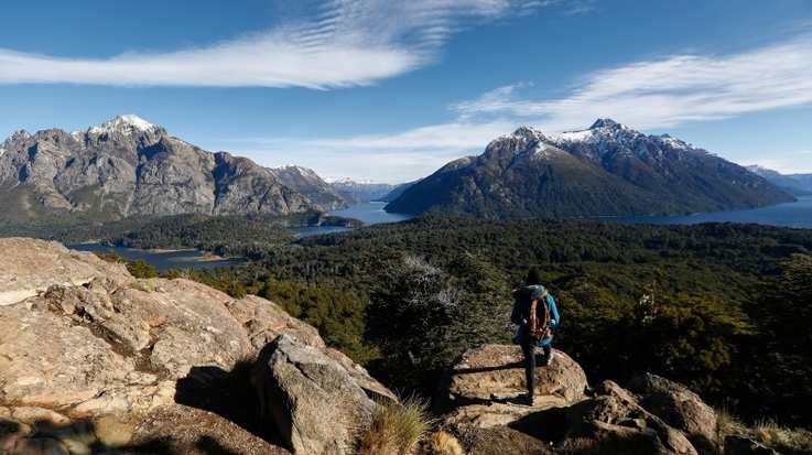 Woman contemplates the landscape, circuit boy, Bariloche in Argentina in October.