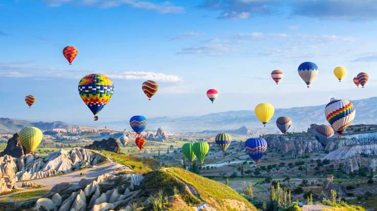 Fly in these colorful hot air balloons while visiting Turkey in February.