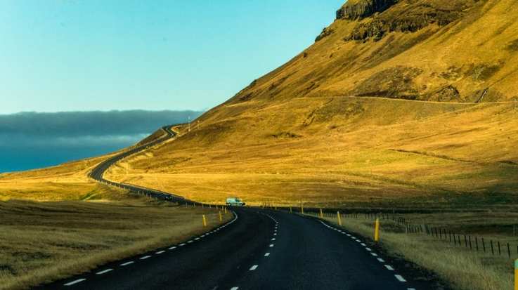 In the west of Iceland, a mountain near the sea surrounded it by the road