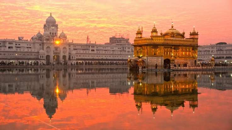 Check out the golden structure on a pond at sunset in India while spending 10 days in India.