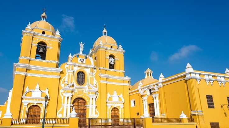 Magnificent yellow cathedral with a beautiful blue sky in Trujillo, Peru in August