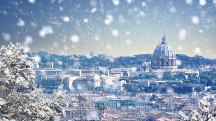 Snowfall in Rome during the Christmas month at winter sunset in Italy in December.