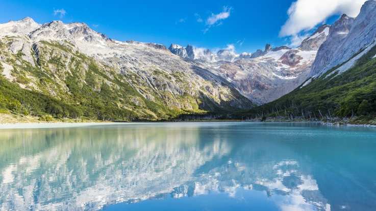 Andes mountain reflecting in lake Laguna Esmeralda in Patagonia in November.