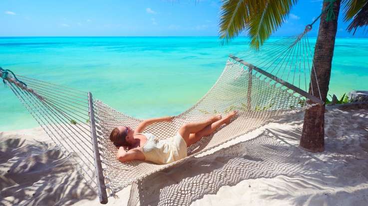 Woman relaxing in one of the best beaches in Zanzibar.