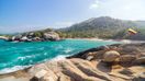 Visit the tropical beach in Tayrona National Park while spending one week in Colombia.