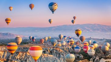 You can see hot air balloons rise when you travel from Izmir to Cappadocia.