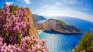 Navagio beach with shipwreck and flowers on Zakynthos island in Greece in April.