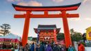People enter Fushimi Inari Shrine on New Year's Day in Japan in January.