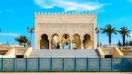 Snow white Mausoleum of Mohammed V against the blue sky, Rabat, Morocco