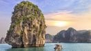 Watching the seascape sunset at Halong Bay is one of the top things to do in Vietnam