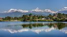 snow-capped mountains, green hills and a lake in Pokhara, Nepal