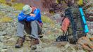 Trekker resting due to altitude illness in the Himalayan region of Nepal