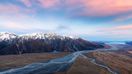 Aoraki Mount Cook National Park in winter in New Zealand with red clouds.