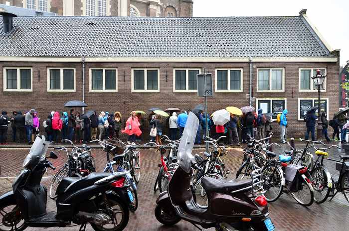 People queuing at the Anne Frank house and holocaust museum in Amsterdam Netherlands on May 16 2015. Anne Frank house is a popular tourist destination.
