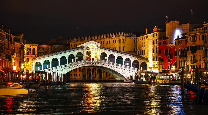Rialto Bridge (Ponte Di Rialto) in Venice Italy at night time.