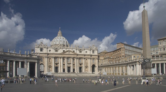 St. Peter's basilica with square and obelisk against cloudscape. 