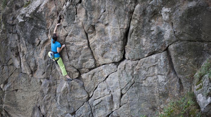 Young Woman Rock Climbing