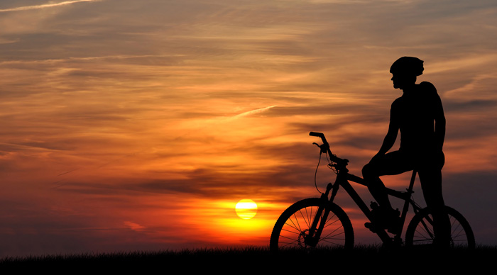 Silhouette with text top mountain bike tours in Nepal
