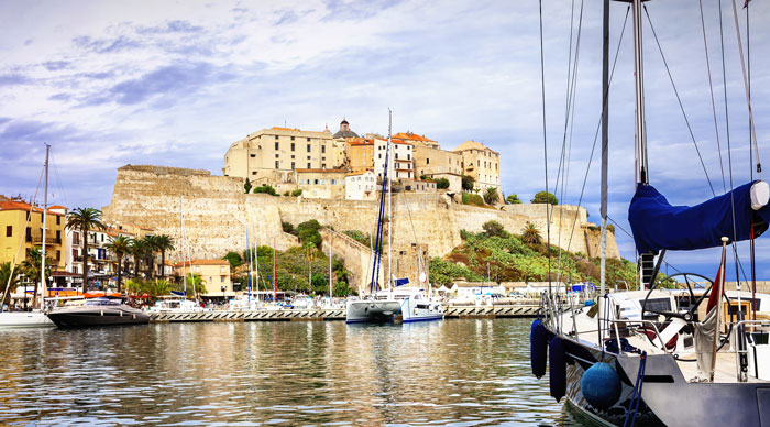A view of Corsica with marina and fortress