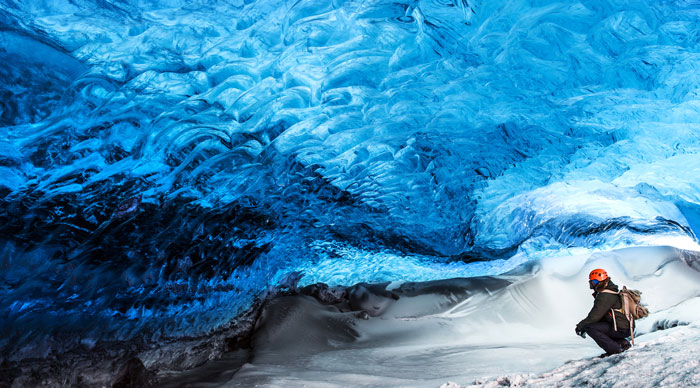 Traveler enjoying views in the ice cave
