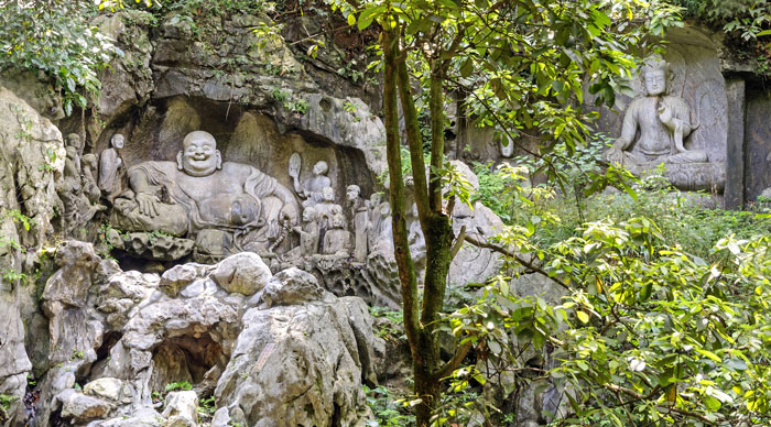 Maitreya And Disciples Carving In Feilai Feng Caves, China