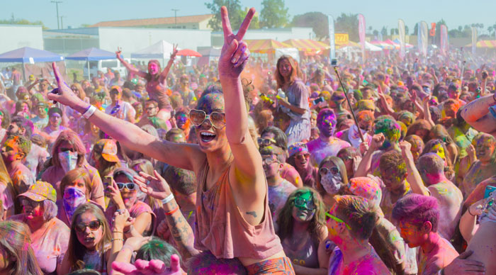 People celebrating holi in a large group