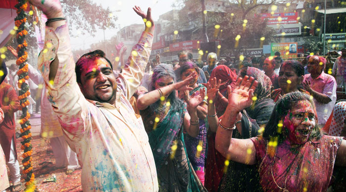 People covered in paint on Holi festival