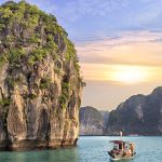 Dreamy sunset among the rocks of Halong Bay, Vietnam
