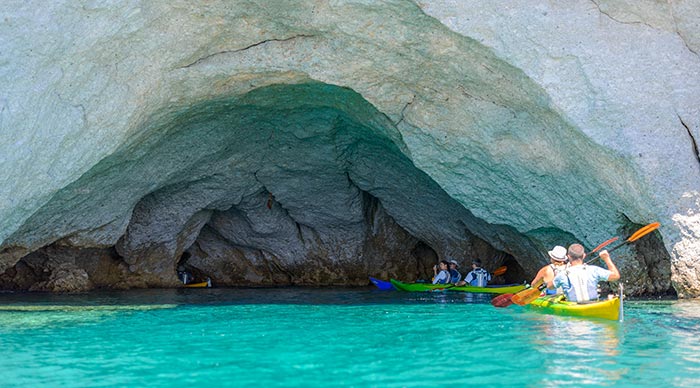 A group of tourists kayaking in the sea