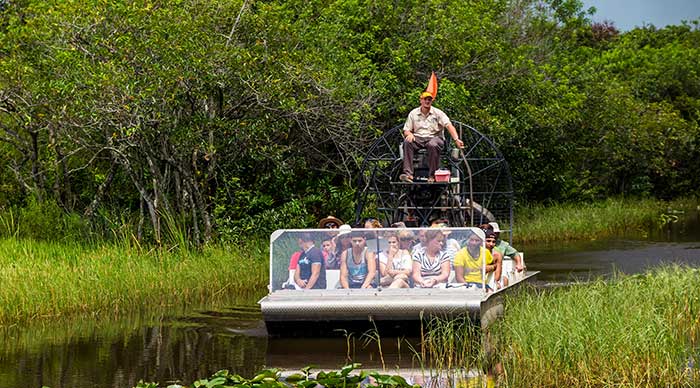 Tourists riding boats in the Everglades