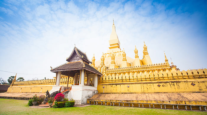 Laos travel landmark golden pagoda wat Phra That Luang in Vientiane